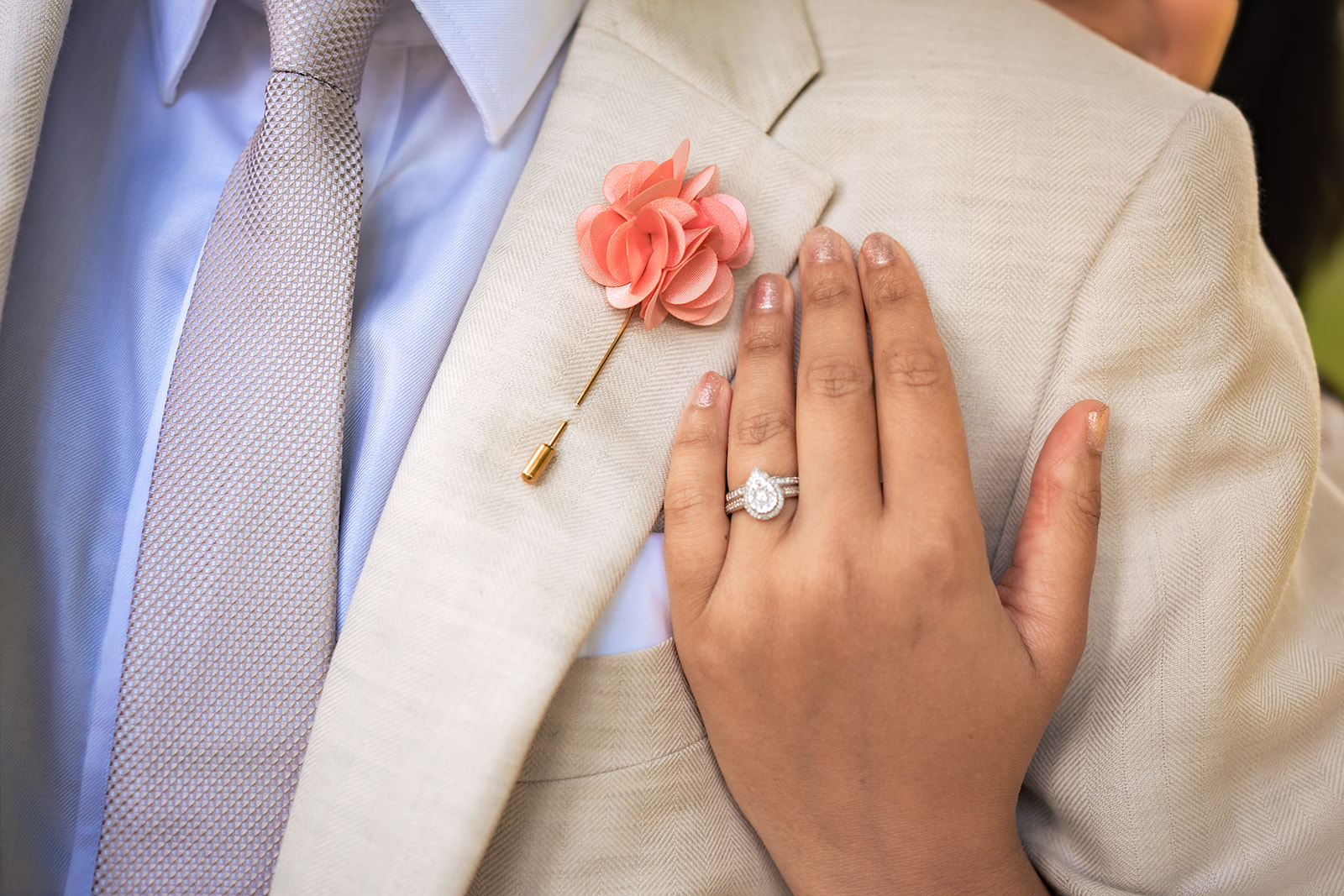Wedding ring and buttonhole detail during a post wedding shoot in Hampshire