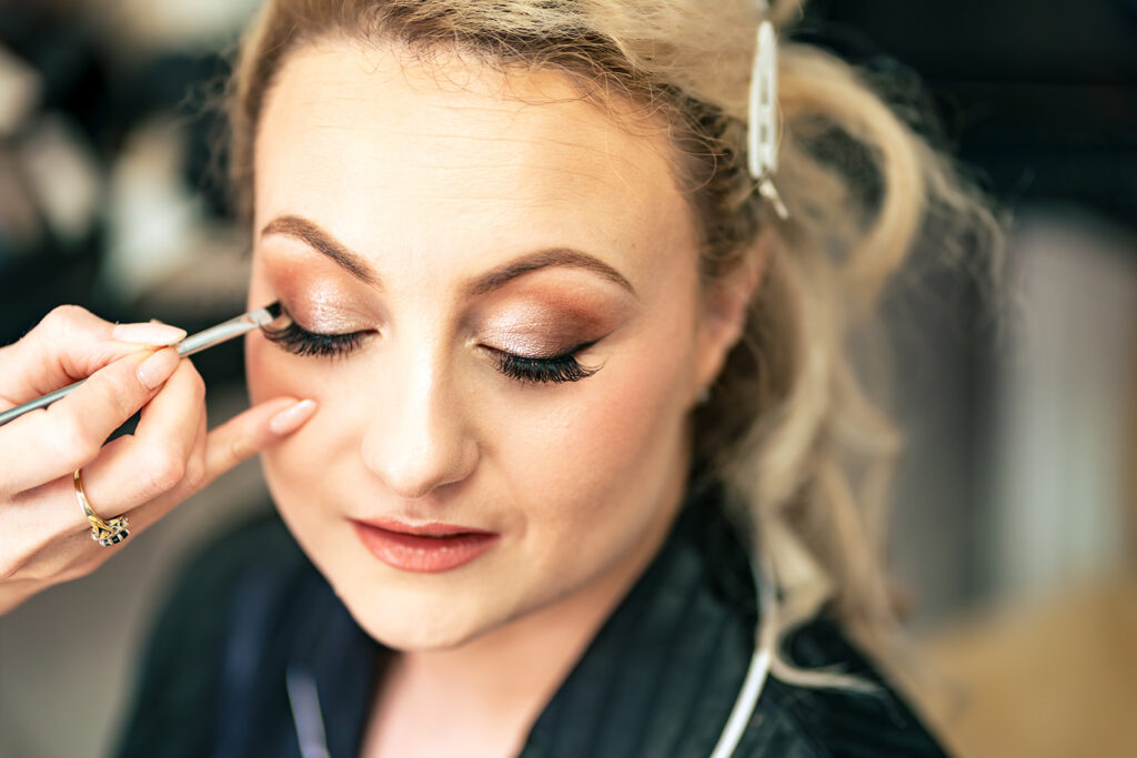 Bride having her make up done at Skylark Golf and Country Club, Whiteley