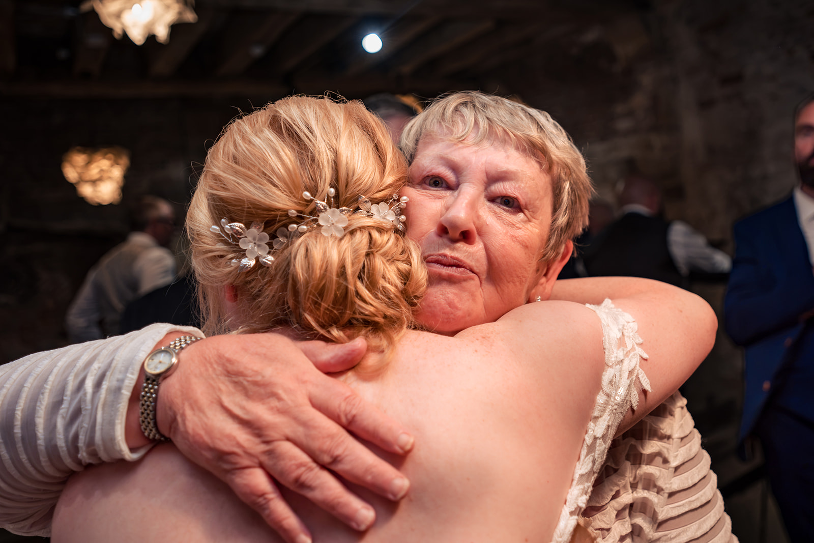Bride hugging a guest at The Square Tower wedding