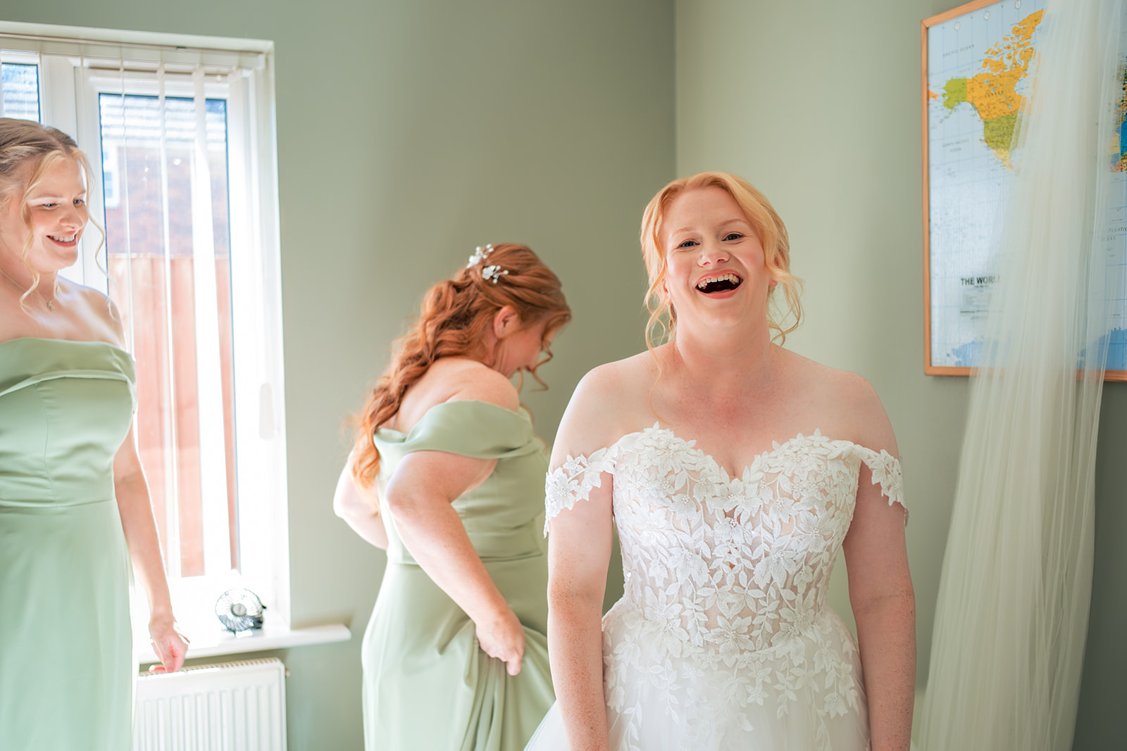 Bride laughing with her bridesmaids before her Square Tower Old Portsmouth wedding