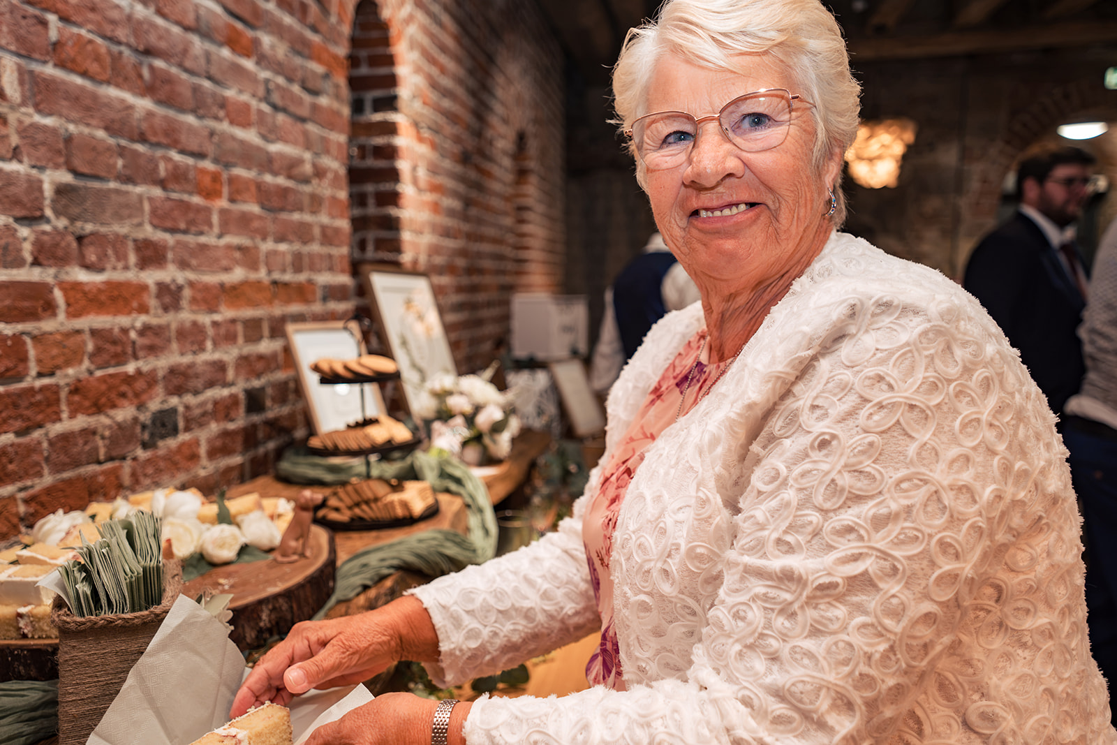 Older guest laughing at the wedding reception at The Square Tower