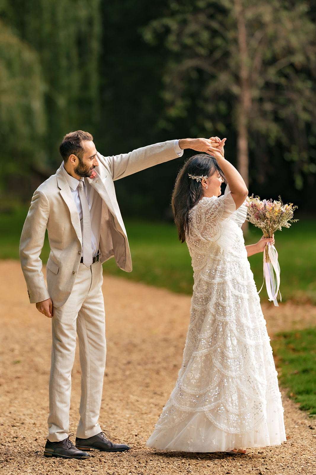 Couple dancing on the path during their post wedding shoot at Staunton Country Park