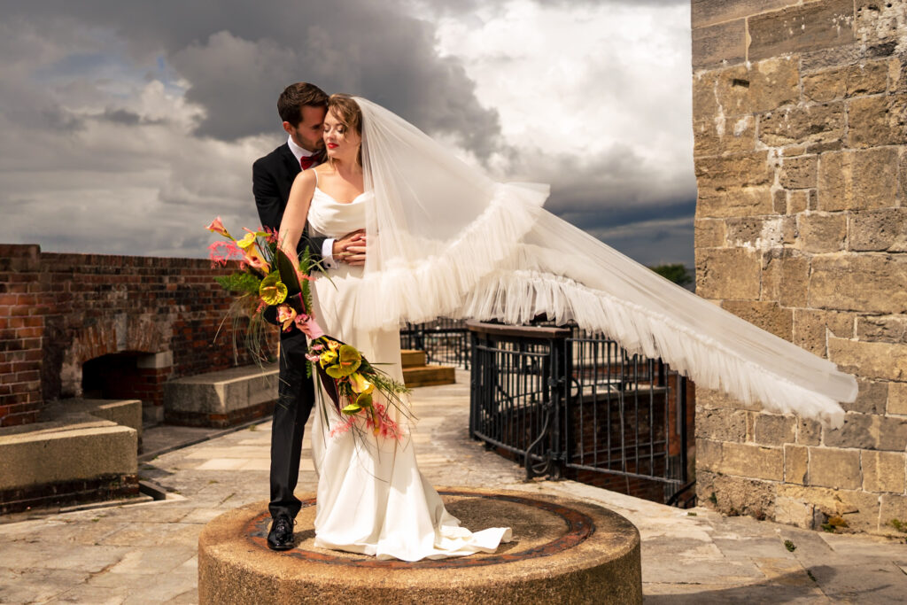 Wedding dress and veil styled flat lay at Ashbys and Southsea Castle, styled shoot