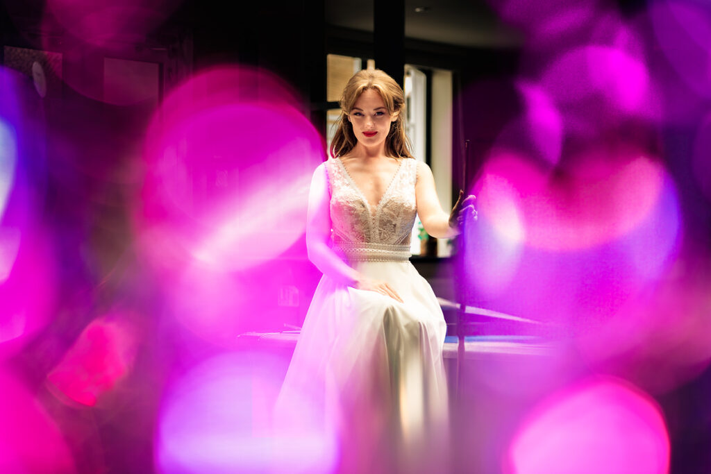 Bride in a pink haze of light at Ashbys and Southsea Castle, styled shoot
