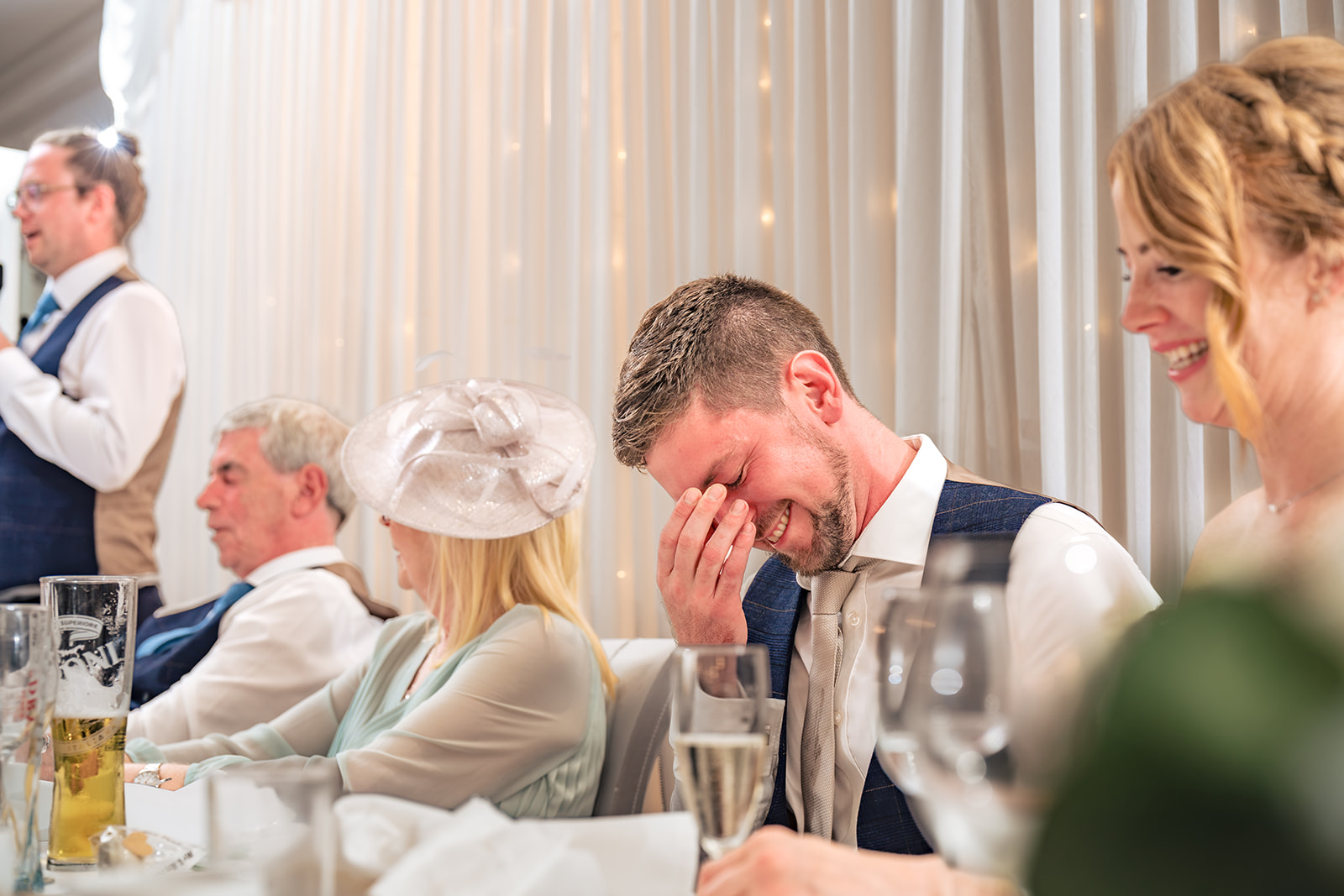 Top table in fits of laughter during the wedding speeches at Hotel Miramar Bournemouth
