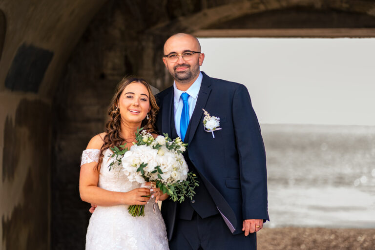 Portrait of Sadie and Antonio by the sea wall