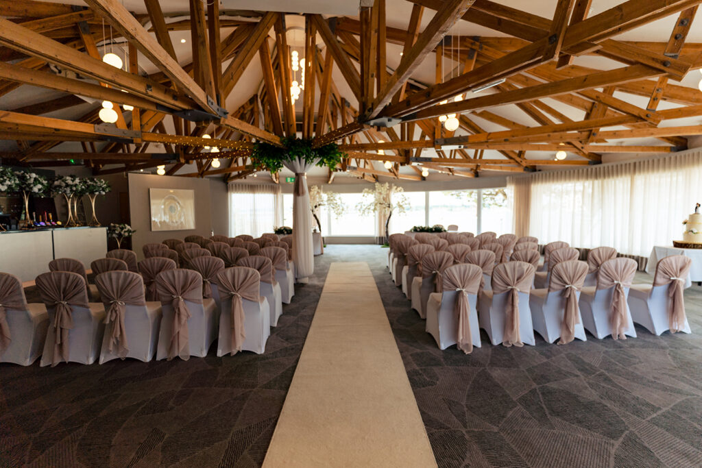 Ceremony room set up with an aisle to the water view at Langstone Quays Resort, Hayling Island