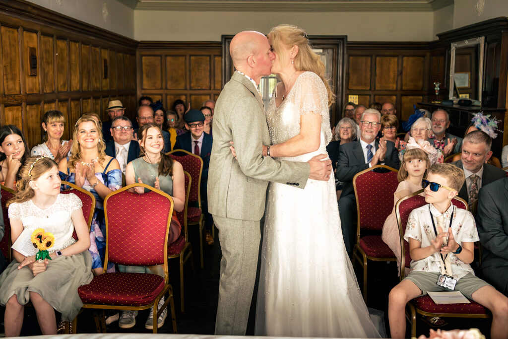 First kiss in front of the guests at Lodge Hill Centre, West Sussex