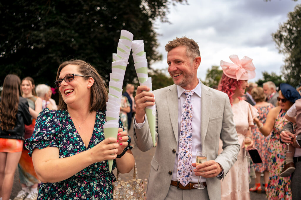 Guests with confetti outside at Lodge Hill Centre, West Sussex