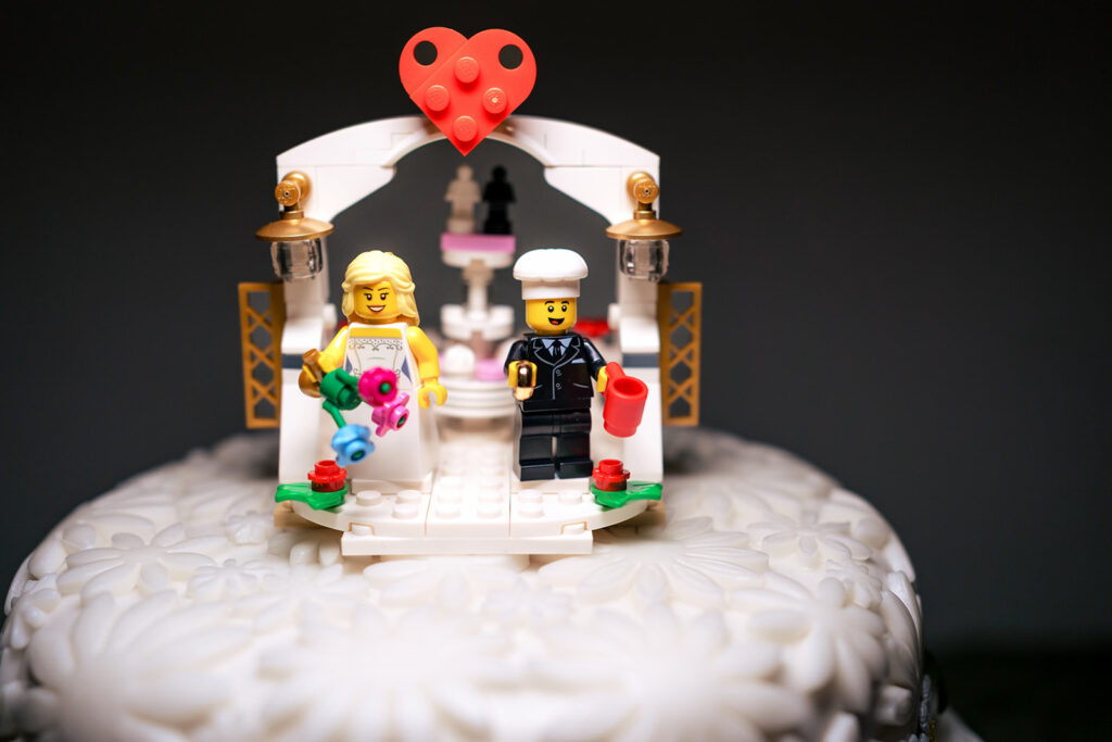 Wedding cake with Lego bride and groom toppers at Lodge Hill Centre, West Sussex
