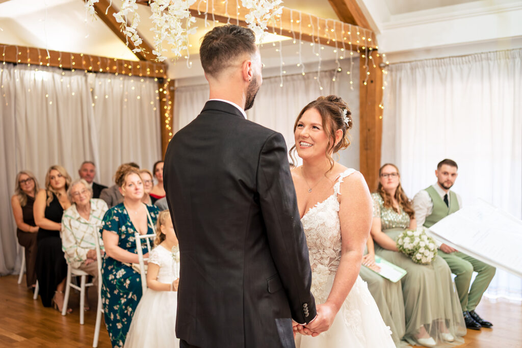 Vows at the front of the ceremony room at Newtown House Hotel, Hayling Island