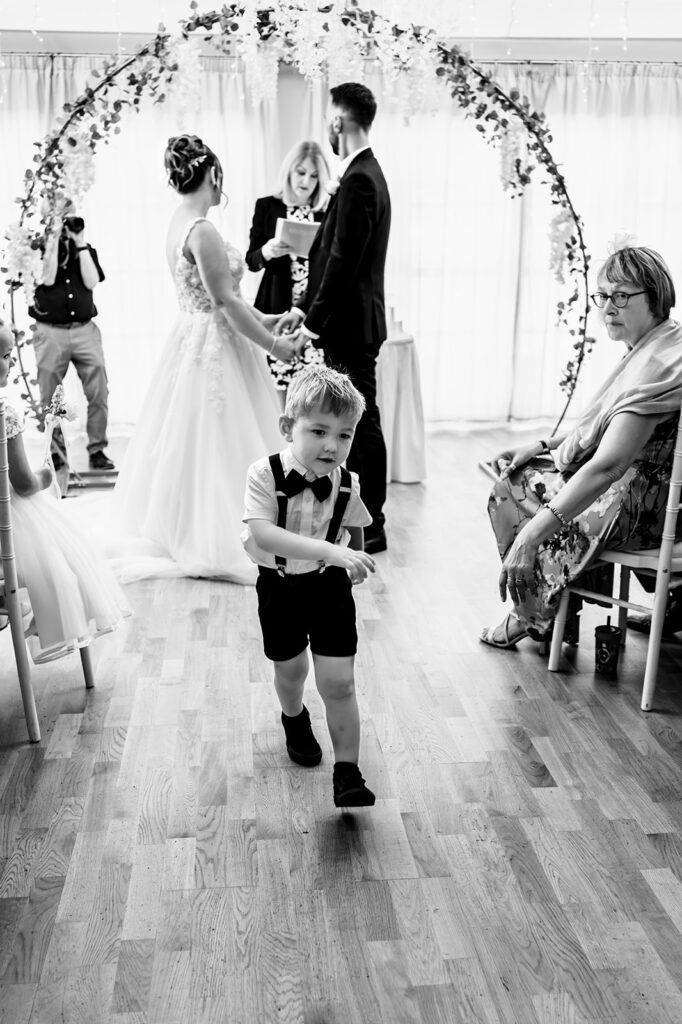 Just married walk back down the aisle, black and white at Newtown House Hotel, Hayling Island