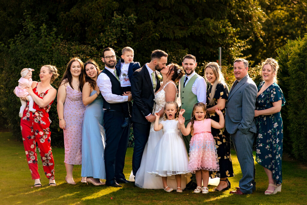Bridal party lined up in the gardens at Newtown House Hotel, Hayling Island