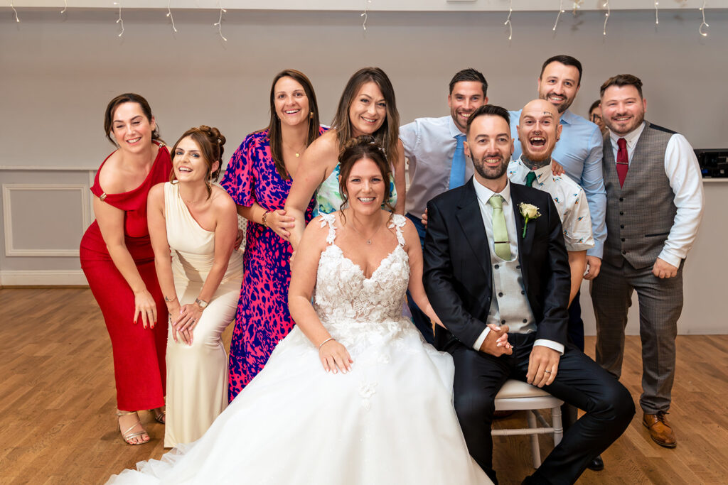 Bride and groom with their bridesmaids at Newtown House Hotel, Hayling Island
