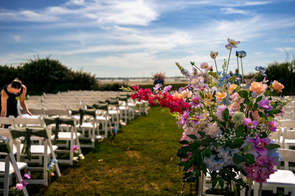 Outdoor ceremony aisle lined with wildflowers at Tournerbury Woods Estate, Hayling Island