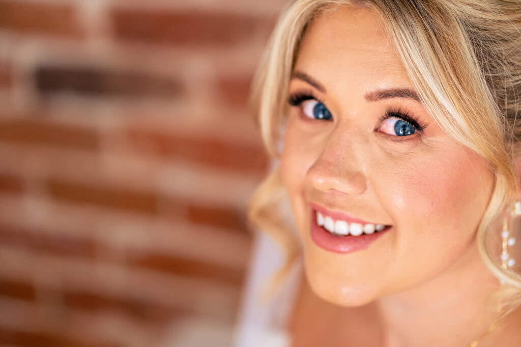 Bride smiling during getting ready at Tournerbury Woods Estate, Hayling Island