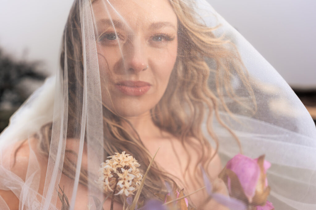 Veil wrapped around the face at Butser Hill, Wuthering Heights styled shoot