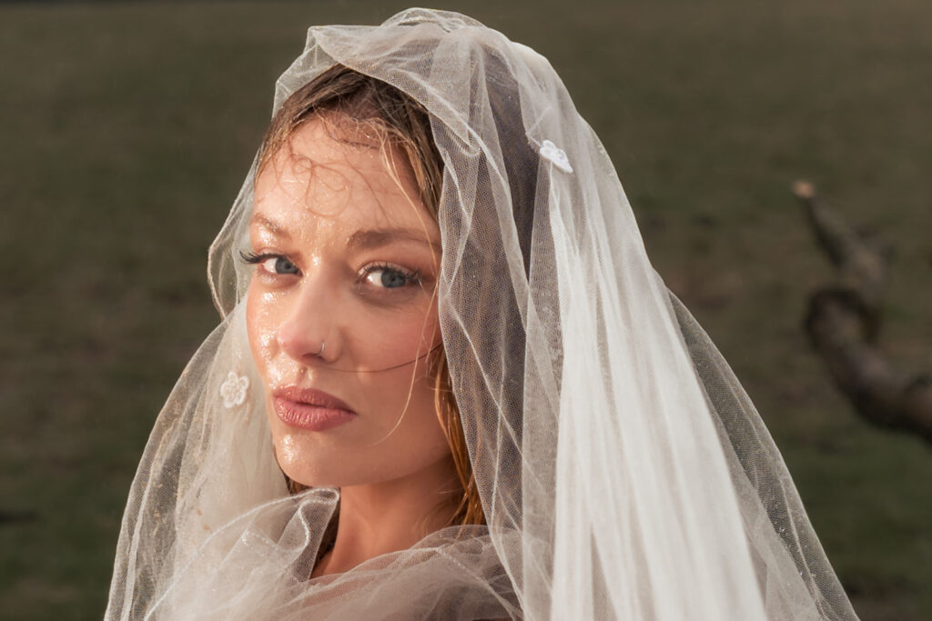 Bride in a lace veil at Butser Hill, Wuthering Heights styled shoot