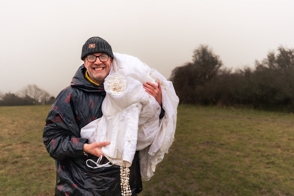 Behind the scenes carrying the dress at Butser Hill, Wuthering Heights styled shoot